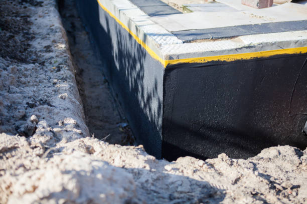 Professional Basement Waterproofing technician working in North Tonawanda, NY
